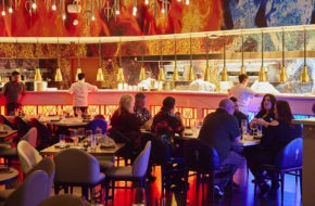 The colorfully lit dining room at Hell's Kitchen in Atlantic City