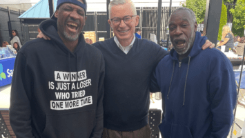 Former Gov. Jim McGreevey with two smiling supporters