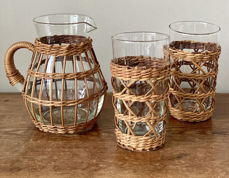 Rattan-encased glasses and pitcher