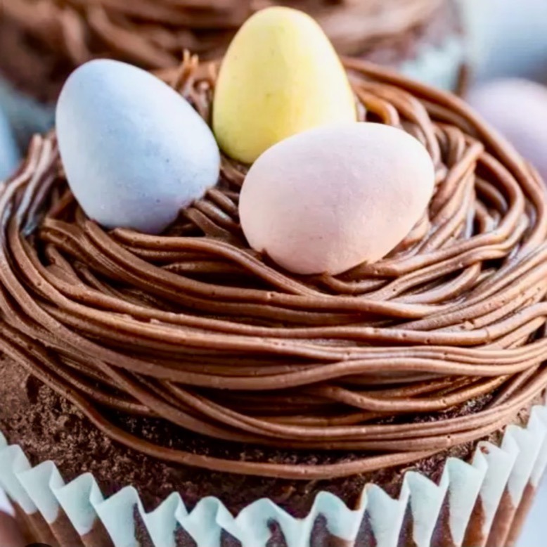 A chocolate cupcake topped with pastel-colored Easter eggs at Madame Cupcake Shop in Hopewell