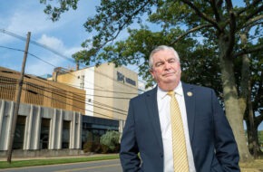 Freehold Mayor Kevin Kane in front of the Nescafé plant in Freehold