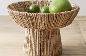 Handwoven seagrass bowl with green fruit