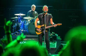 Drummer Max Weinberg performs behind Bruce Springsteen