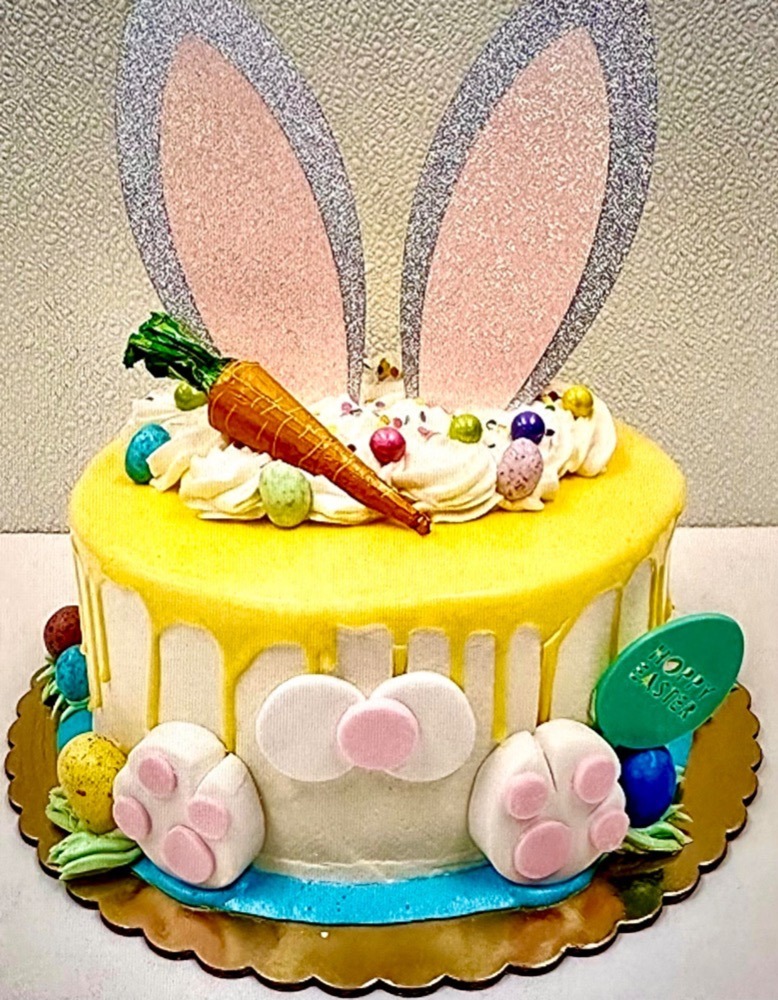 An Easter-themed cake at Sweet Eats Bakery in Voorhees featuring edible Easter egg, carrot and bunny decorations
