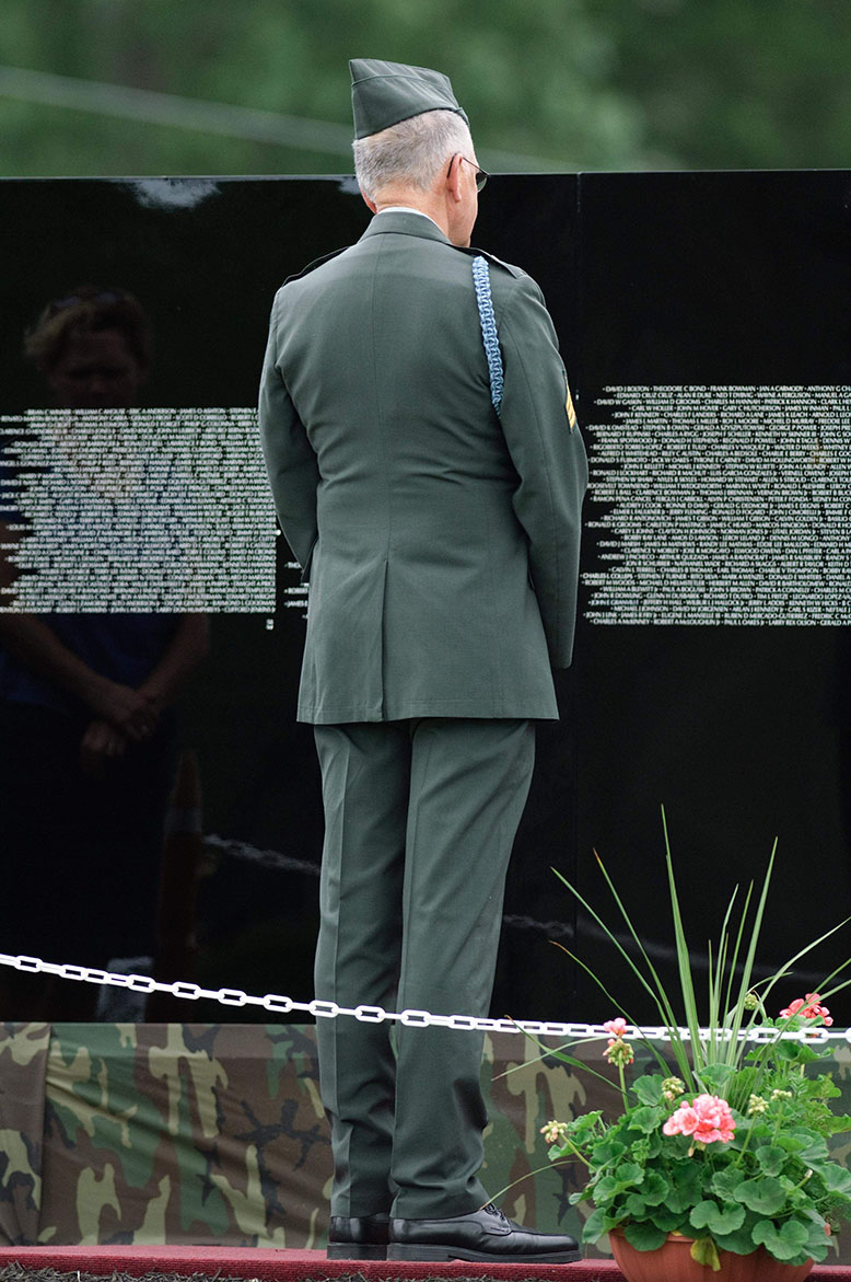 Veteran stands at Vietnam memorial
