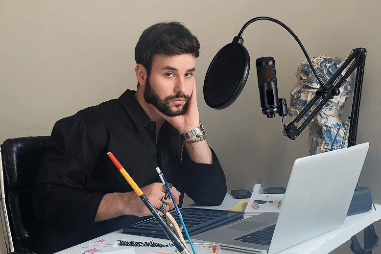 Tarik Mendes amid his recording equipment for his podcast, "Tarik Talk"