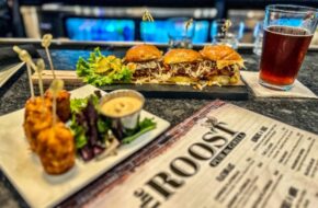 Plates with hamburgers, beer and a menu