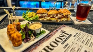 Plates with hamburgers, beer and a menu