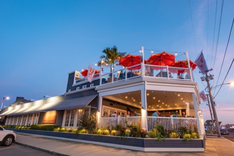 The exterior of Tuckers Tavern at sunset in Beach Haven, Long Beach Island