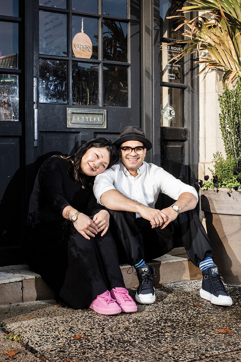 Owners Julia Choi Rodriguez and husband Roger Rodriguez sit on the stoop outside Vesta Chocolate in Montclair.