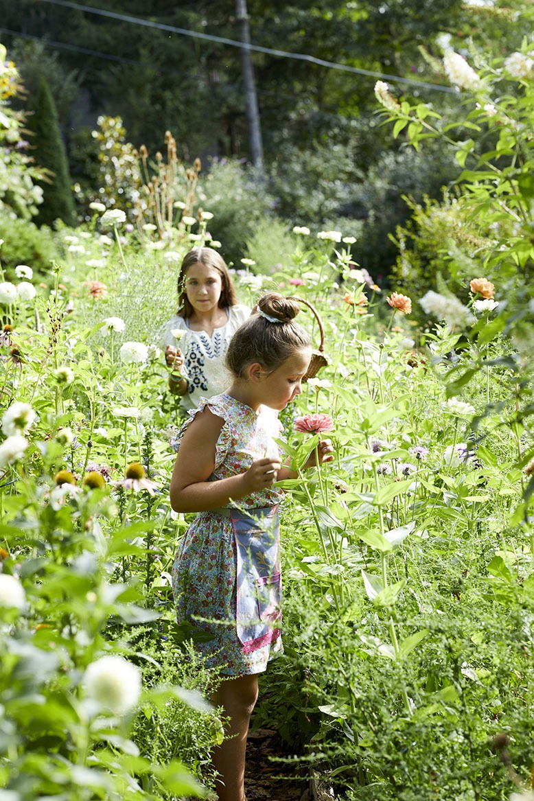 Nancy's granddaughters in her garden