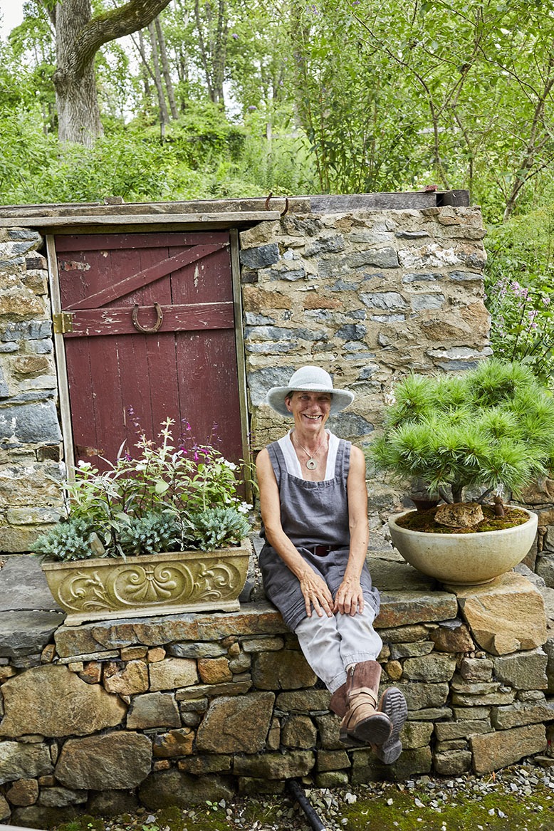Anderson sits on her garden's nearly 200-year-old stone stoo