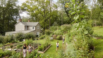 Nancy Kay Anderson gardening on her Lambertville property with daughter and granddaughters