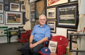 Rev. Dr. Robert W. Ralph in his baseball memorabilia-rich basement