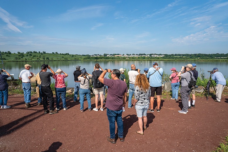 Over a dozen birdwatchers gathered at Mill Creek Marsh.