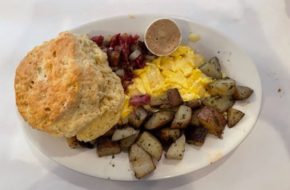 A platter of scrambled eggs, corned beef hash, home fries and a biscuit at the Buttered Biscuit in Bradley Beach