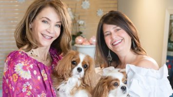 Calia owners Margery St. John and Angela Casiero hold their dogs, who sometimes visit their Bernardsville shop.