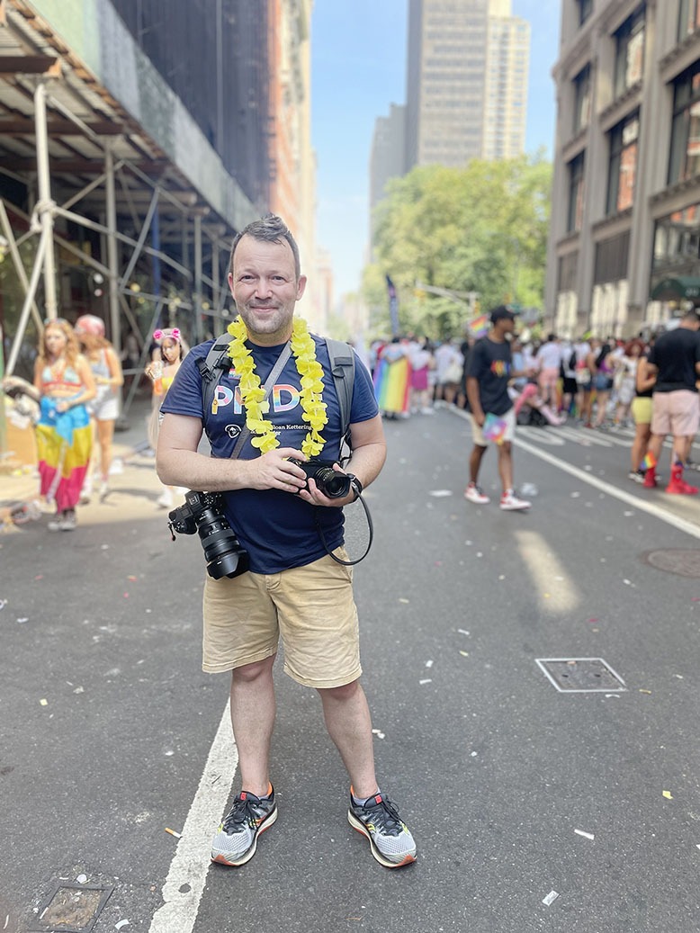 Maplewood photographer Chad Hunt taking photos at the NYC Pride parade.