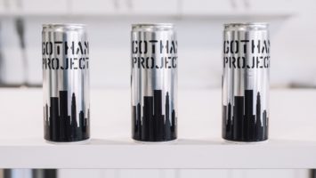 Three cans of Gotham Project wine.