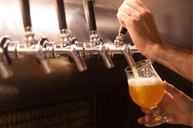 Beer being poured from a tap