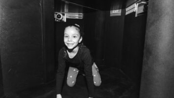 Young girl exploring Liberty Science Center's Touch Tunnel