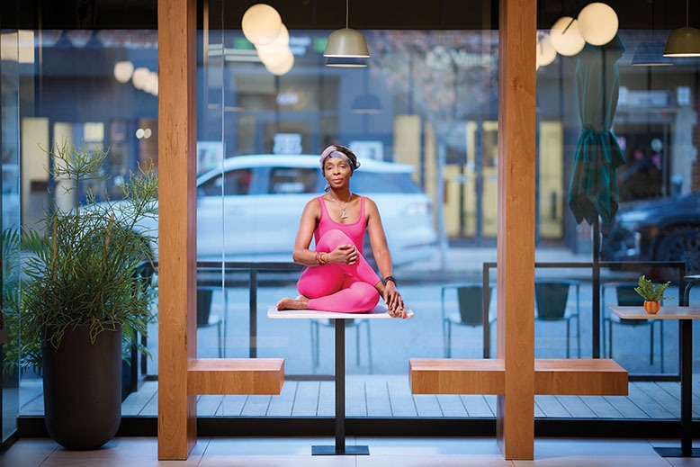 Chef Ingrid Wright does yoga on a tabletop