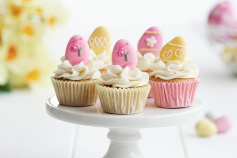 Pastel pink and yellow Easter-themed cupcakes