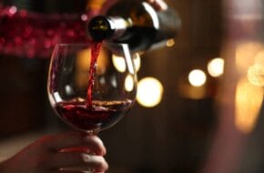 Red wine being poured into glass