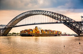 A freighter floats under the Bayonne Bridge