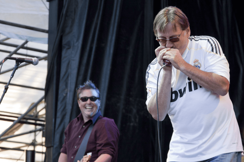 Southside Johnny playing harmonica