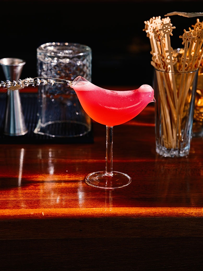 The bright Songbird cocktail at the Lookout in North Cape May sits in a bird-shaped glass
