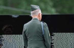 Veteran stands at Vietnam memorial