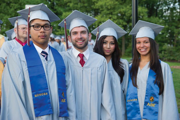 Students celebrate their 2014 graduation from the County College of Morris.