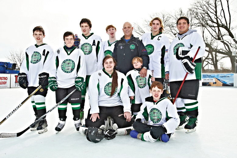 Coach Alex DePalma with members of the Brick Stars special-needs hockey team.