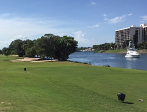 Seen from the 6th tee of the North Palm Beach Country Club (a public course), a yacht approaches the infernal drawbridge. Traffic stops while it slowly crosses the inlet to the ocean. Photo: Eric Levin