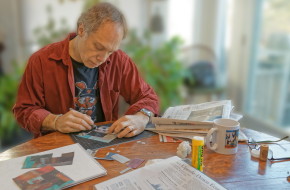 Peter Jacobs hard at work on a collage.
