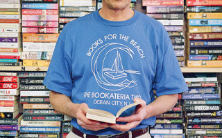 Wood Robinson, owner of Ocean City's Bookateria Two, stocks plenty of beach reading for his flip-flop wearing customers.