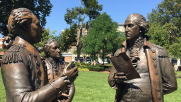 Hamilton, middle, and Washington listen to Lafayette's 1780 vow of support on the Morristown Green.