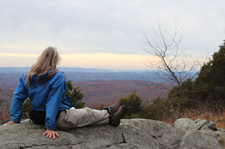 A hiker gazes across Worthington State Forest near the intersection of the Appalachian and Rattlesnake trails.