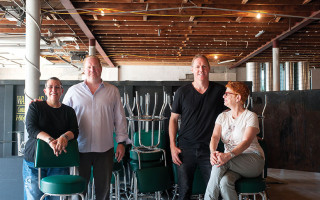 The Smith partners–from left, Meg Brunette, Jim Watt, Jason Watt and Kyle Lepree–survey the old Burlington City firehouse they aim to transform into a stylish eatery.