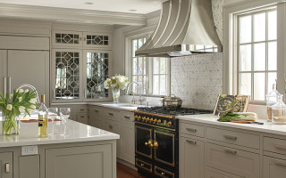 The removable fretwork on the antique glass-front cabinet doors was inspired by Chinese window screens.