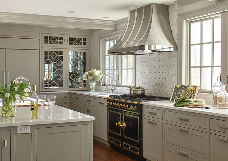 The removable fretwork on the antique glass-front cabinet doors was inspired by Chinese window screens.