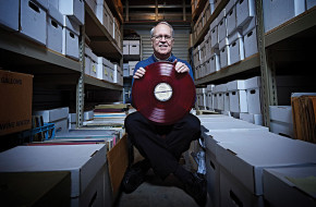 Charlie Horner amid the archive of recordings, documents and photos he and his wife maintain to preserve the "classic urban harmony" they love.