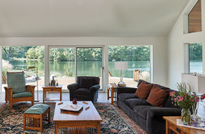 Light pours into the living room of Kathy and John Junek's Sussex County lake house.