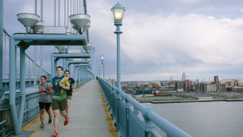 Runners cross the Ben Franklin Bridge from Camden to Philadelphia.