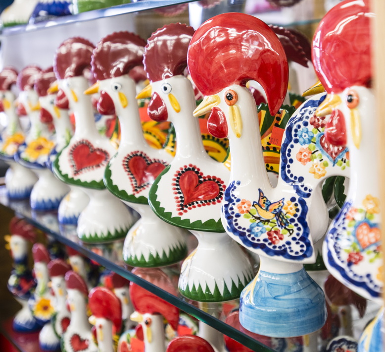 Traditional ceramic roosters beckon shoppers at Portugalia Sales in Newark.