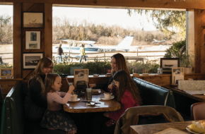 Small planes and gliders zip past the windows at Donna's Runway Cafe.