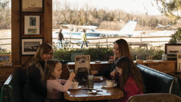 Small planes and gliders zip past the windows at Donna's Runway Cafe.