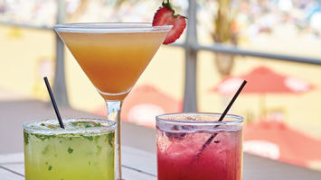 Summer sippers at Avenue include, from left, Pineapple Cilantro Jalapeno Margarita (made with Milagro Tequila); Peach Passion (360 Georgia Peach vodka); and Le Blue Fairy (Belvedere Wild Berry vodka).