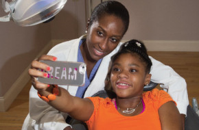 Karen Hankerson, 13, takes a selfie with Dr. Nicole McGrath at her private practice in Montclair. Photo by Andy Foster